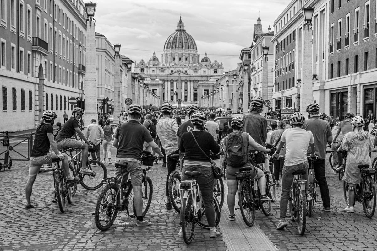 Urban Cycling Safety: Cyclist wearing helmet and reflective gear navigating city traffic calmly