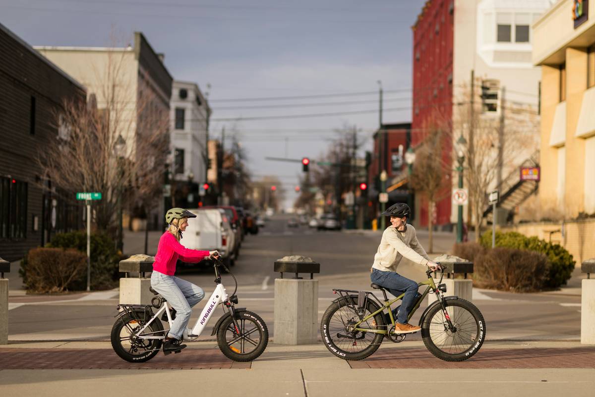 Group enjoying an urban ebike ride through downtown streets with skyline views